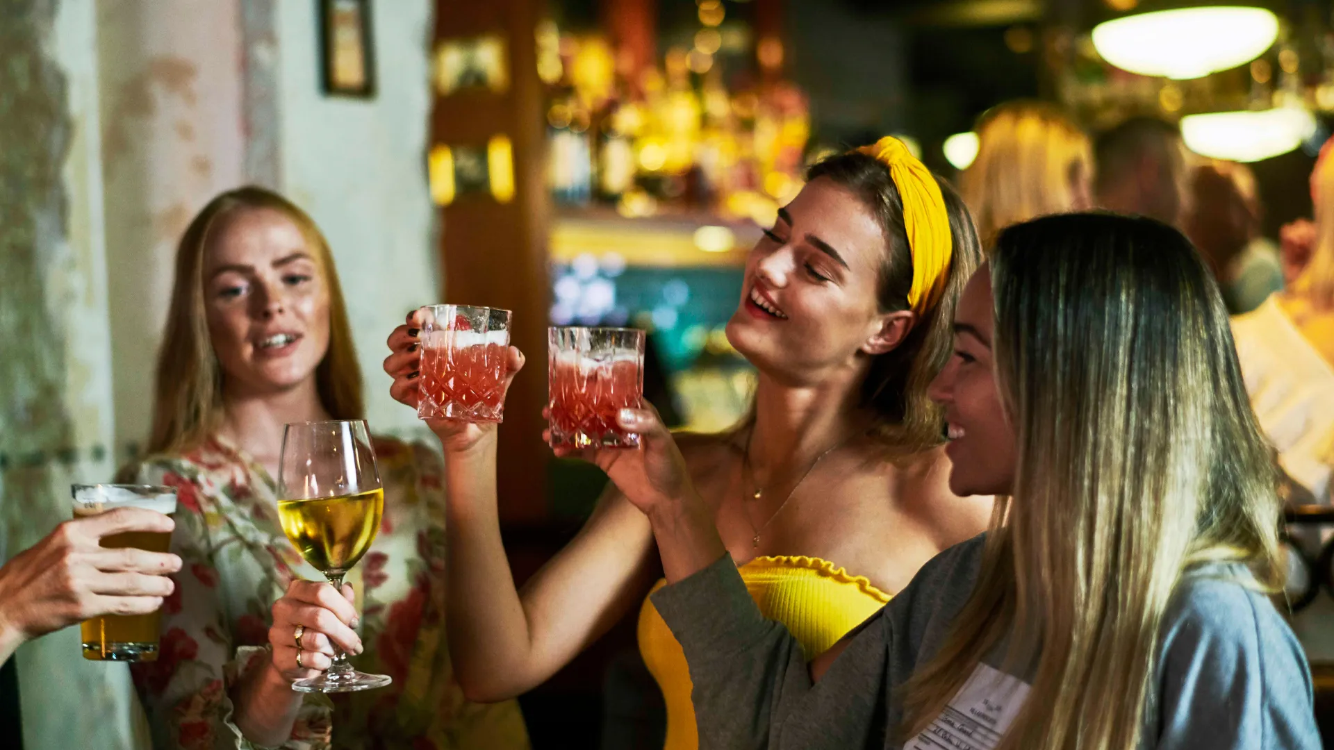 Young females cheering cocktails